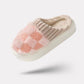 Matching pair of memory foam slippers with an open toe and a thick cushioned sole