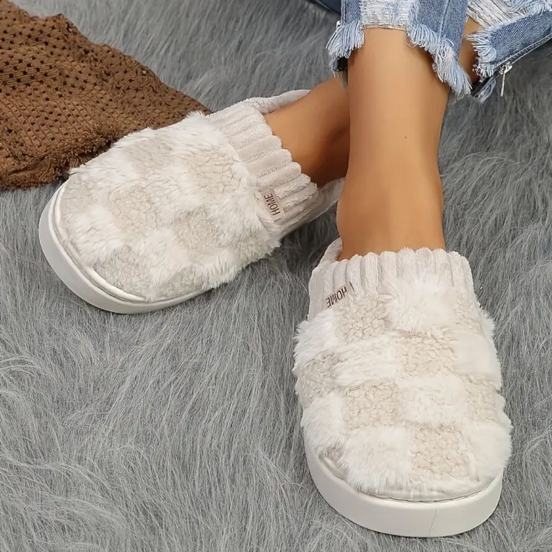 Matching pair of memory foam slippers with an open toe and a thick cushioned sole