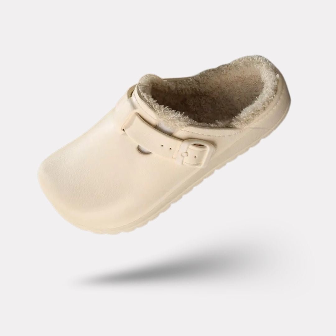 Women's fur-lined slippers in pink, black and white with a closed round toe