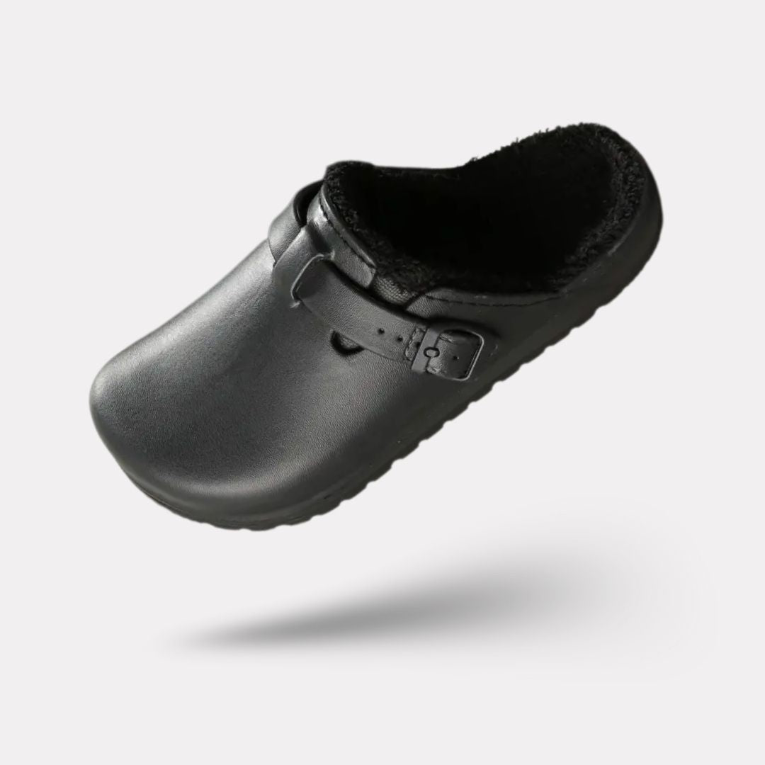 Women's fur-lined slippers in pink, black and white with a closed round toe