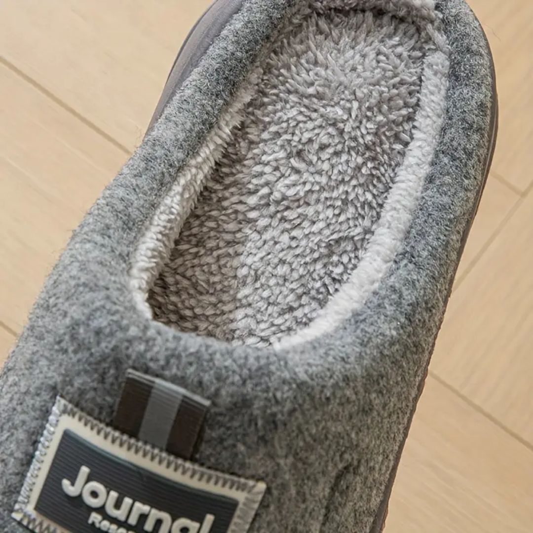 Gray extra-large memory foam slippers with a wide opening and a thick cushioned sole