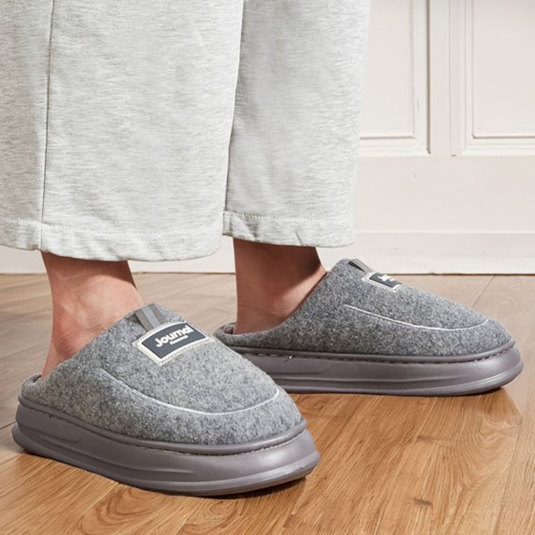 Gray extra-large memory foam slippers with a wide opening and a thick cushioned sole