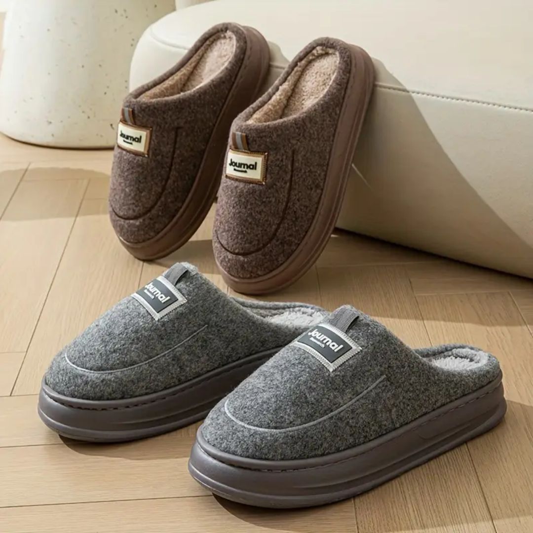 Gray extra-large memory foam slippers with a wide opening and a thick cushioned sole