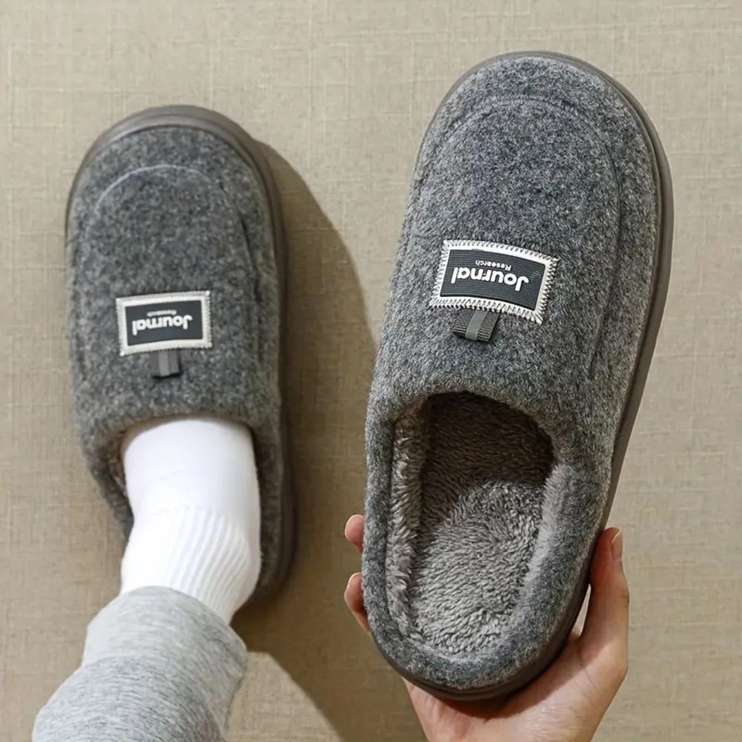 Gray extra-large memory foam slippers with a wide opening and a thick cushioned sole