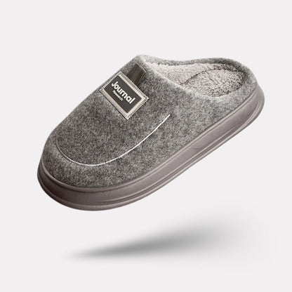Gray extra-large memory foam slippers with a wide opening and a thick cushioned sole