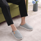 Gray orthopedic slippers with an open toe and a non-slip textured sole