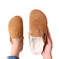 Orthopedic slippers on a cork footbed with a lined upper, in brown, black, green and khaki