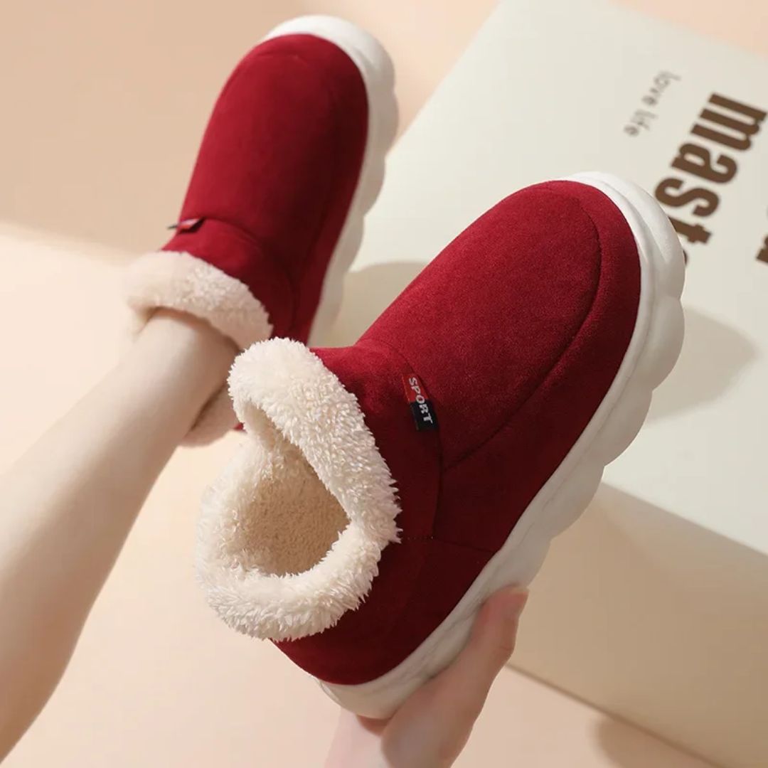 Plush lined winter slippers with a non-slip sole and a supportive footbed