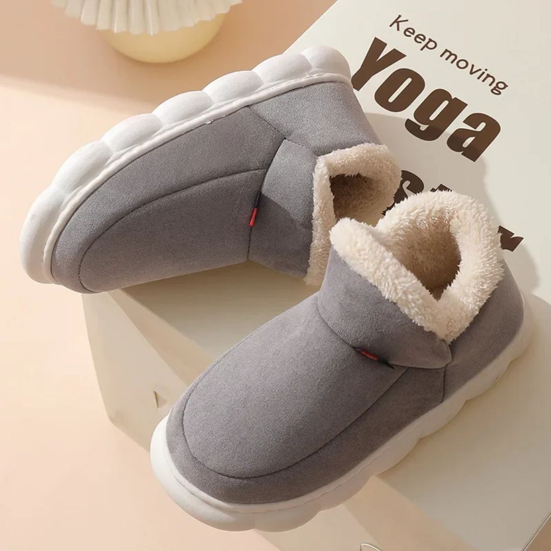 Plush lined winter slippers with a non-slip sole and a supportive footbed