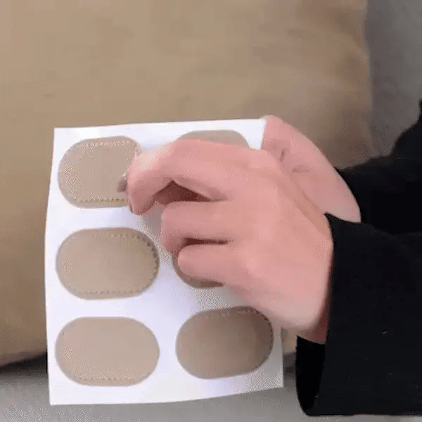 Twelve thin adhesive patches stuck over the bunion to stop rubbing inside the shoe