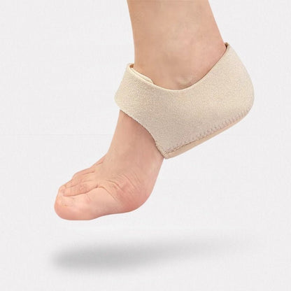 Beige and black gel heel protectors that cup the back of the heel inside the shoe