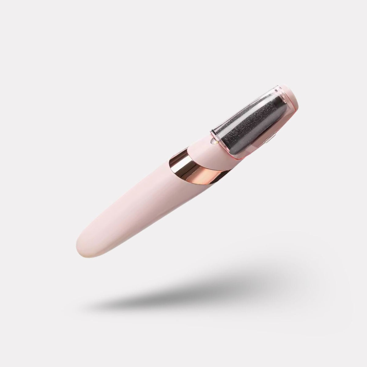 Pink handheld electric callus remover with a rotating roller head for the heel