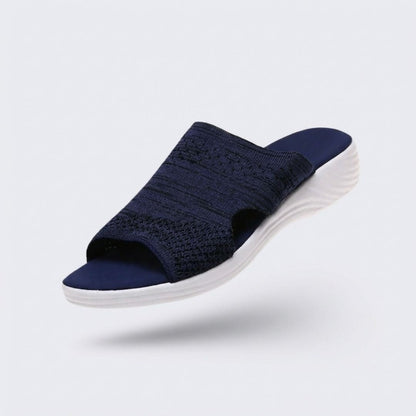 Blue, gray and pink wedge sandals with a supportive contoured footbed and raised heel