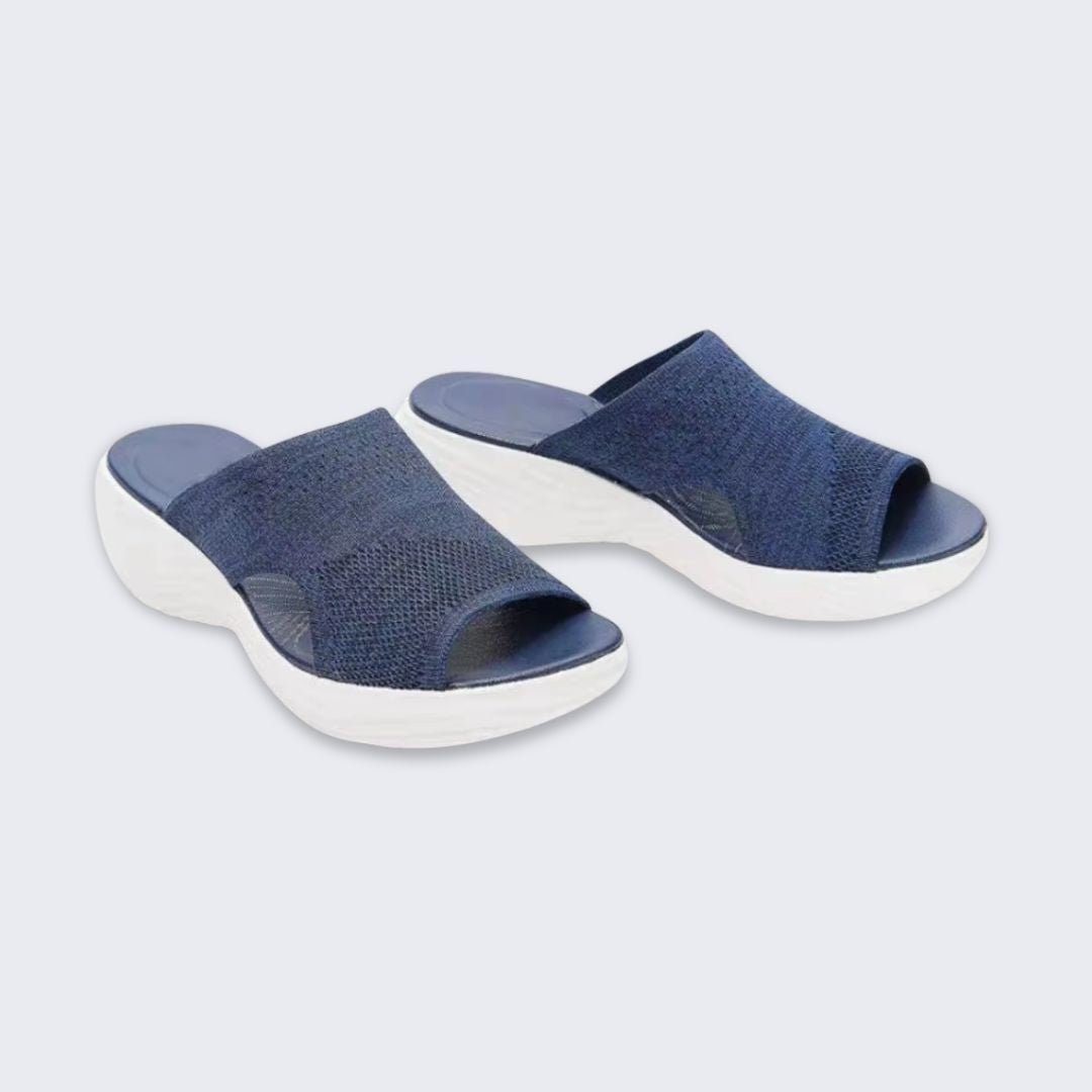 Blue, gray and pink wedge sandals with a supportive contoured footbed and raised heel