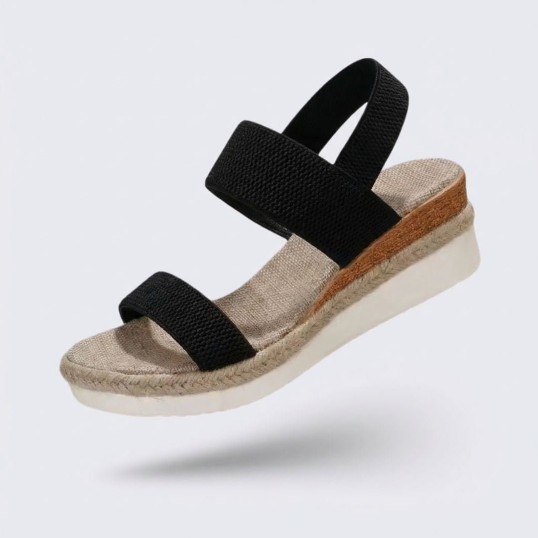 Beige wedge sandals for women with a raised heel and arch supporting footbed