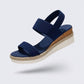 Beige wedge sandals for women with a raised heel and arch supporting footbed