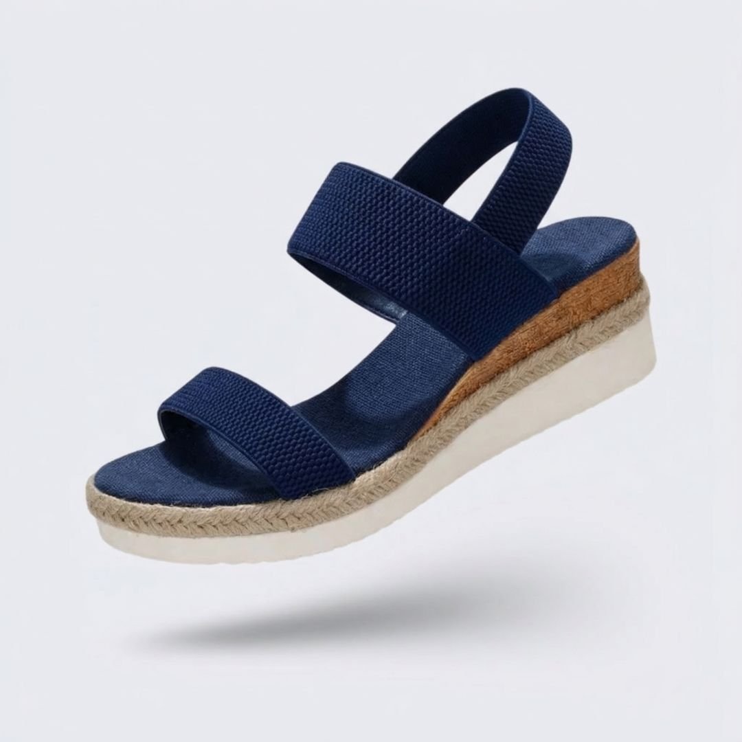 Beige wedge sandals for women with a raised heel and arch supporting footbed