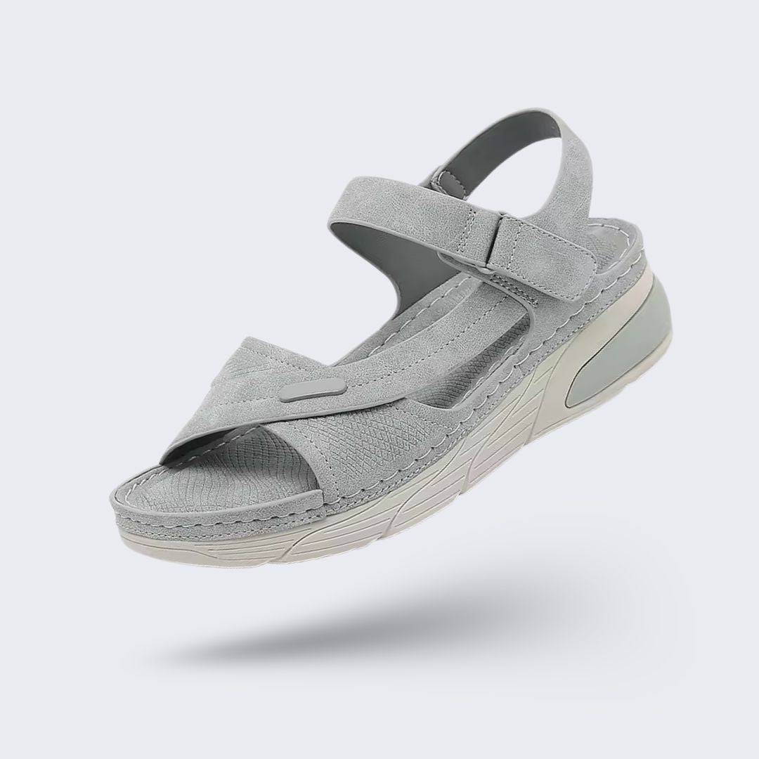 Orthopedic wedge sandals with a raised heel and cushioned footbed, in khaki, gray and blue