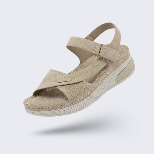 Orthopedic wedge sandals with a raised heel and cushioned footbed, in khaki, gray and blue