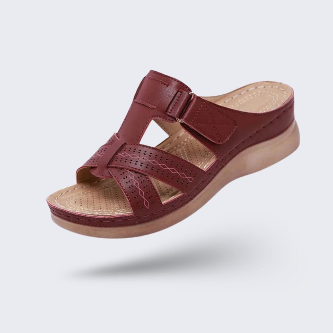 Orthopedic sandals on a raised wedge heel with a supportive contoured footbed