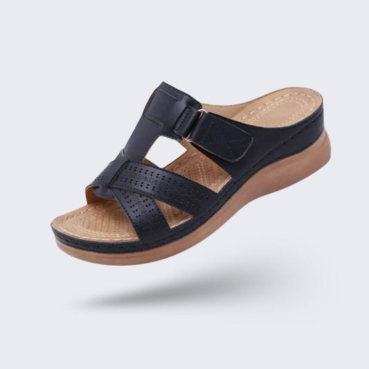 Orthopedic sandals on a raised wedge heel with a supportive contoured footbed