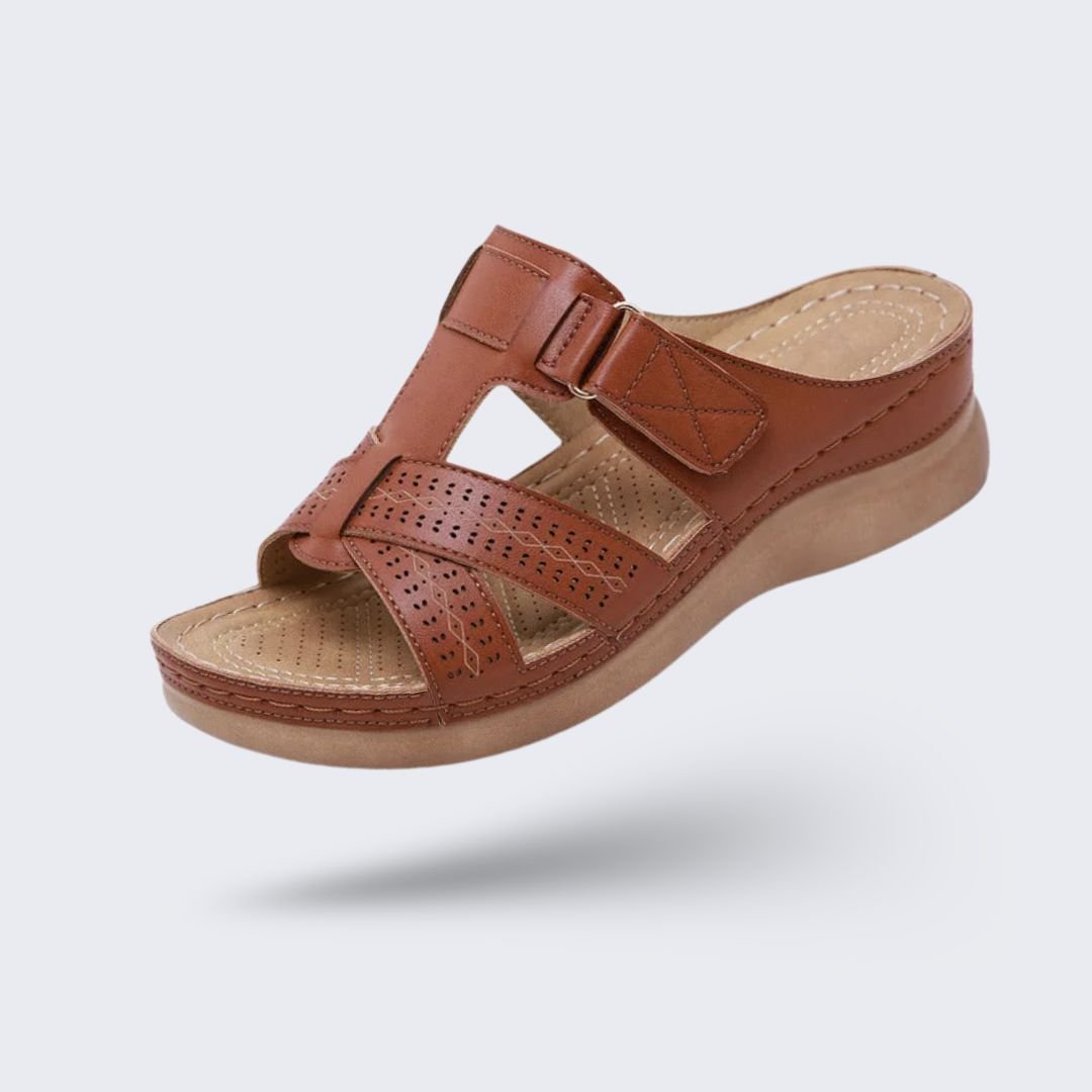 Orthopedic sandals on a raised wedge heel with a supportive contoured footbed