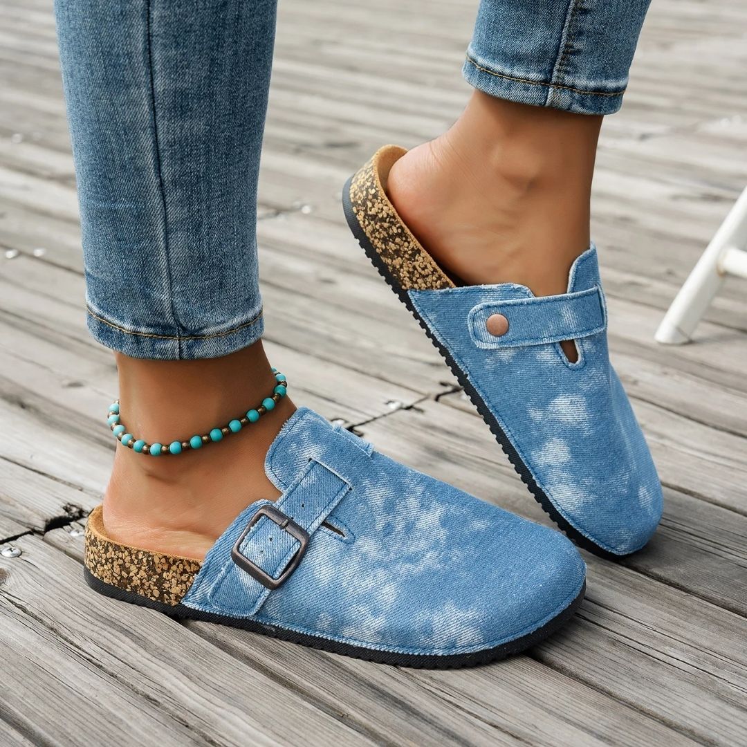 Blue and brown sandals with a contoured cork footbed and adjustable buckled straps