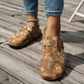 Blue and brown sandals with a contoured cork footbed and adjustable buckled straps