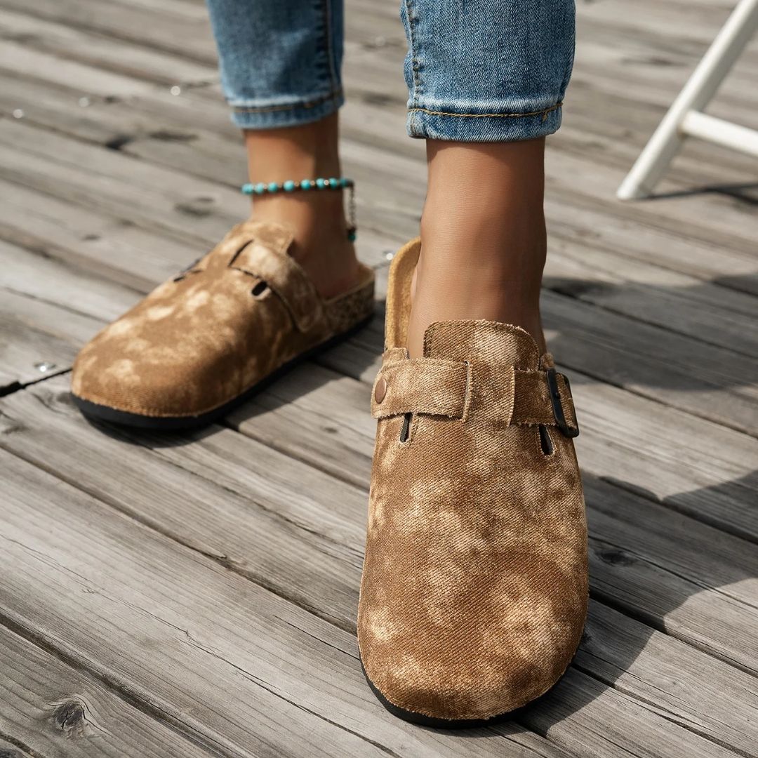 Blue and brown sandals with a contoured cork footbed and adjustable buckled straps