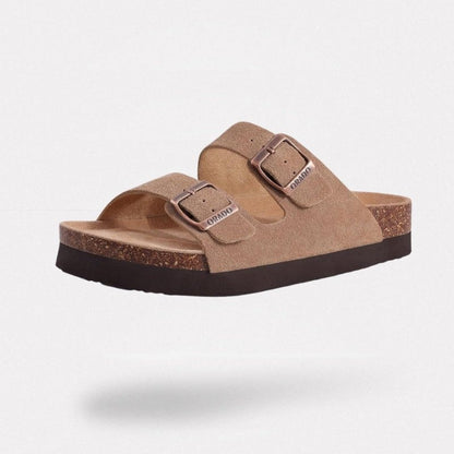 Cream sandals with two buckle straps and a contoured cork footbed