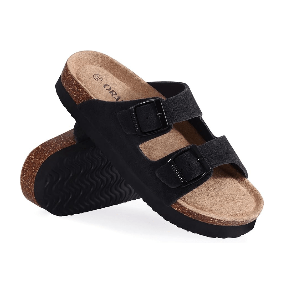 Cream sandals with two buckle straps and a contoured cork footbed