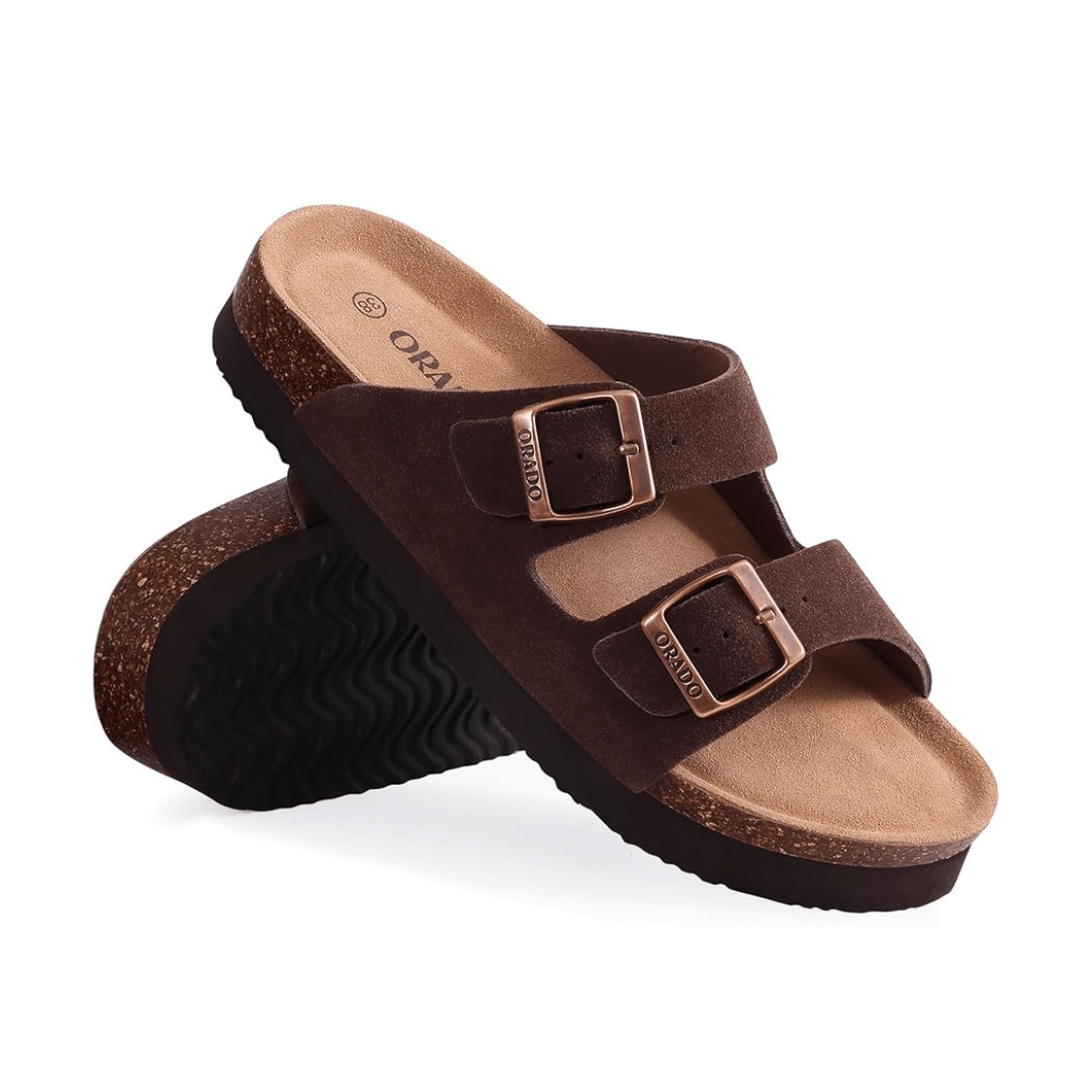 Cream sandals with two buckle straps and a contoured cork footbed