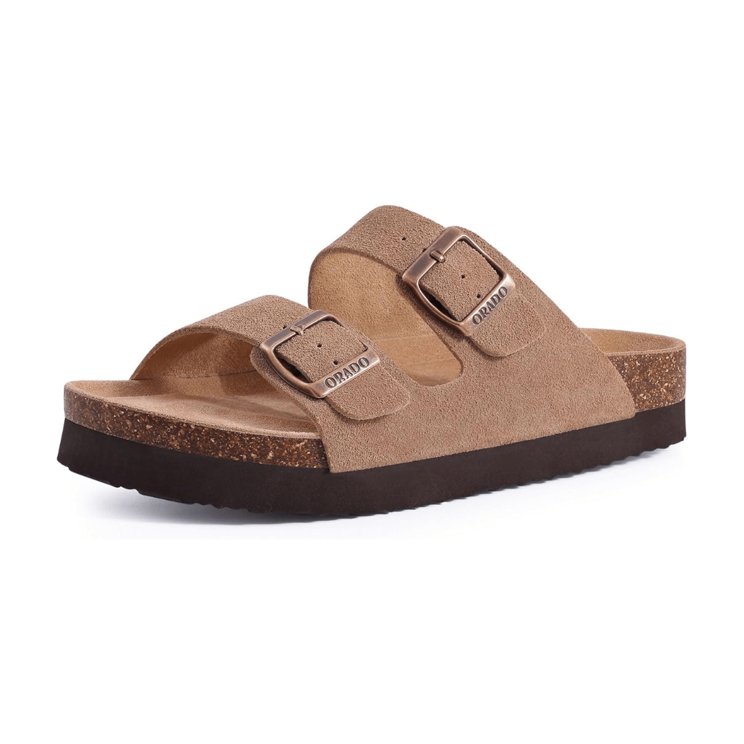 Cream sandals with two buckle straps and a contoured cork footbed