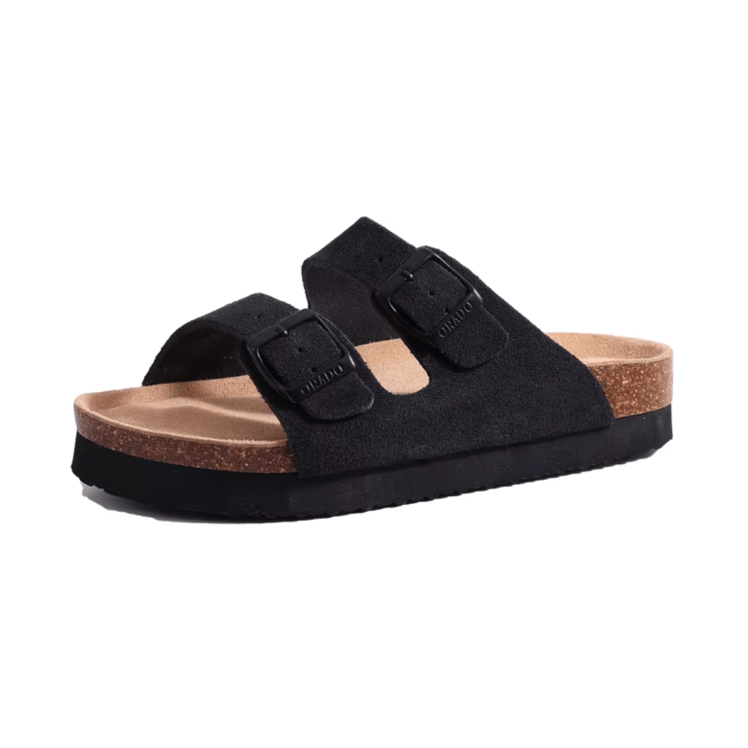 Cream sandals with two buckle straps and a contoured cork footbed