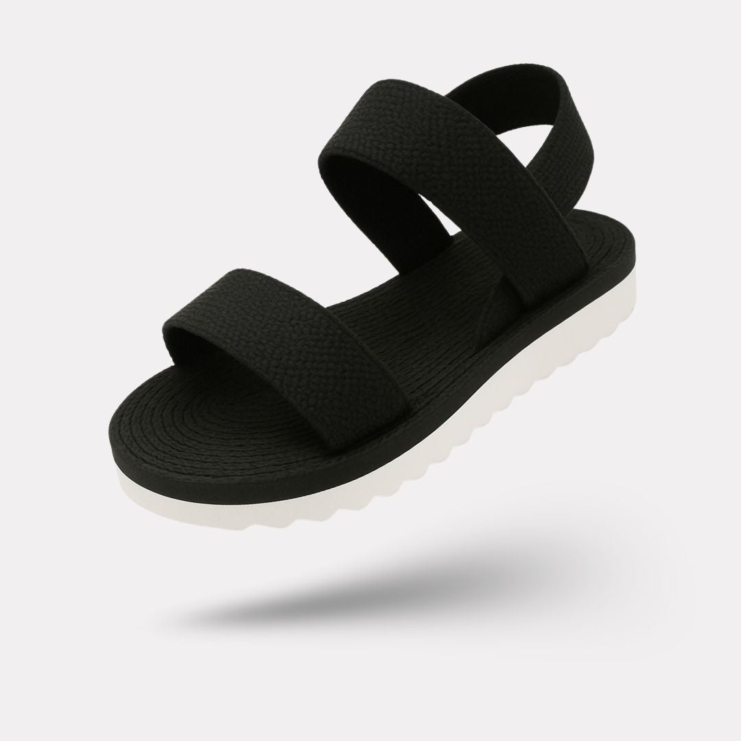Flat orthopedic sandals with a discreet arch in the footbed, in caramel, black and white