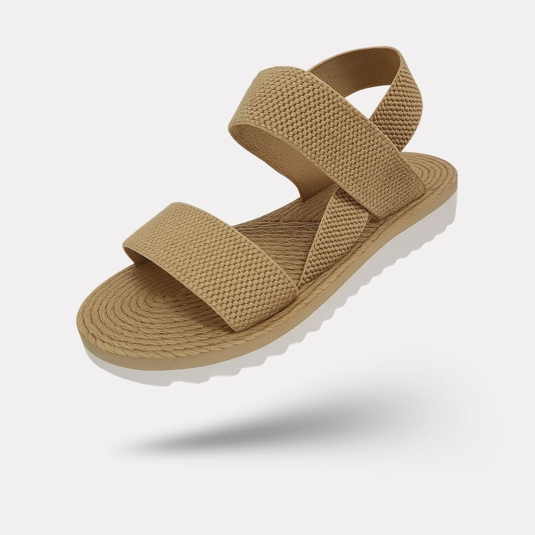 Flat orthopedic sandals with a discreet arch in the footbed, in caramel, black and white