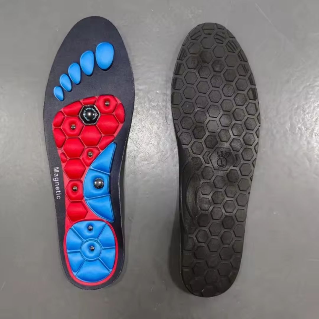 Blue and red acupressure insoles covered with raised massage nubs, placed inside the shoe