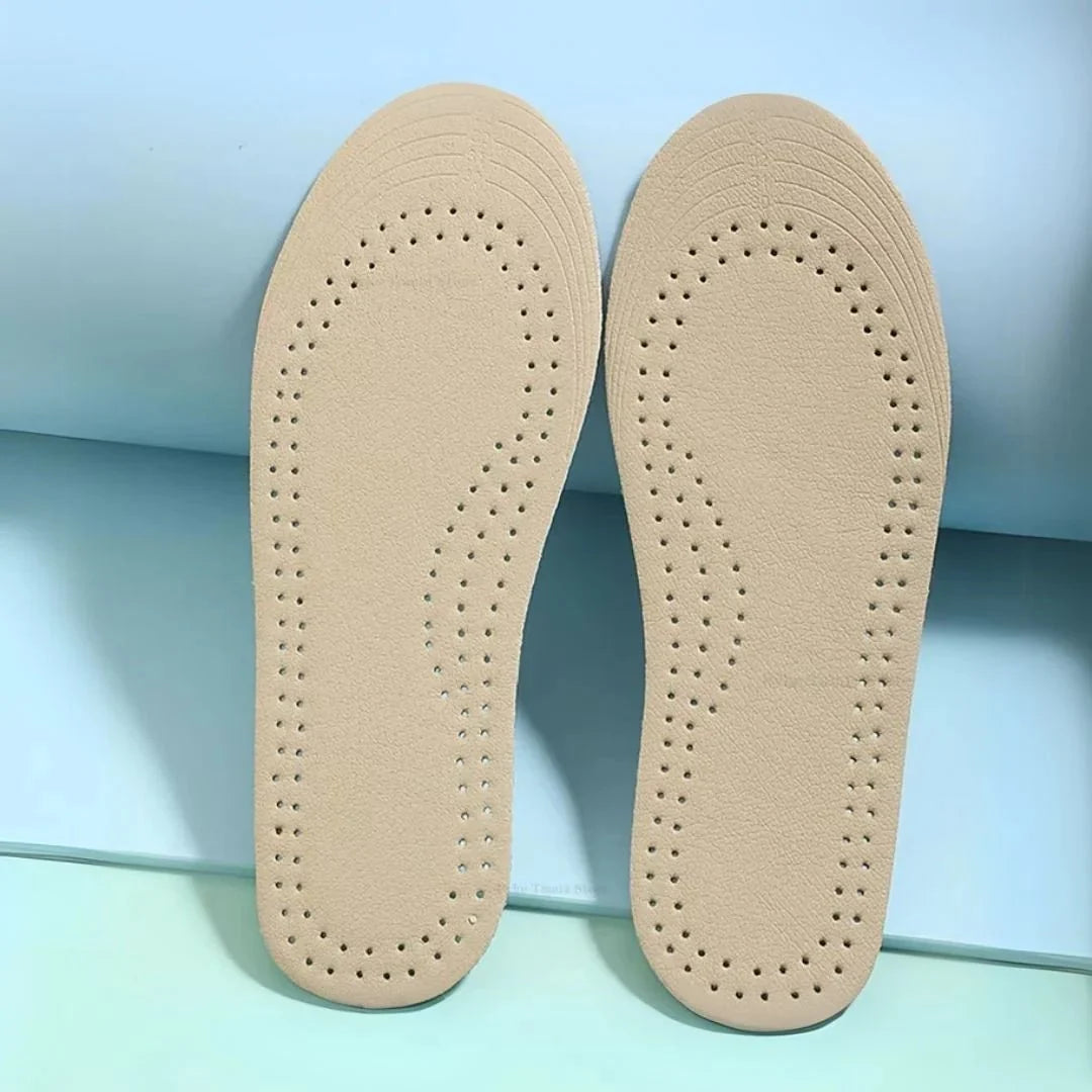 Pair of breathable leather insoles cut to fit inside children's shoes