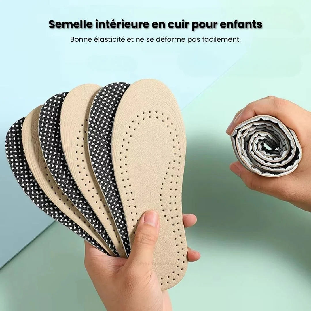 Pair of breathable leather insoles cut to fit inside children's shoes