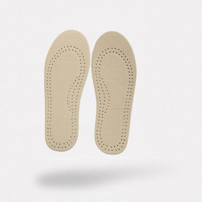 Pair of breathable leather insoles cut to fit inside children's shoes
