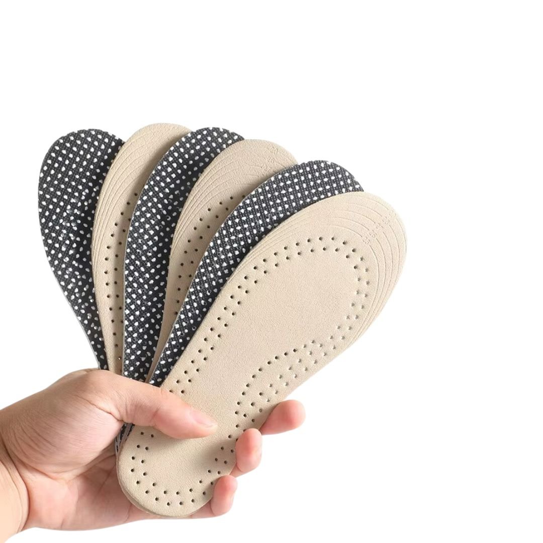 Pair of breathable leather insoles cut to fit inside children's shoes