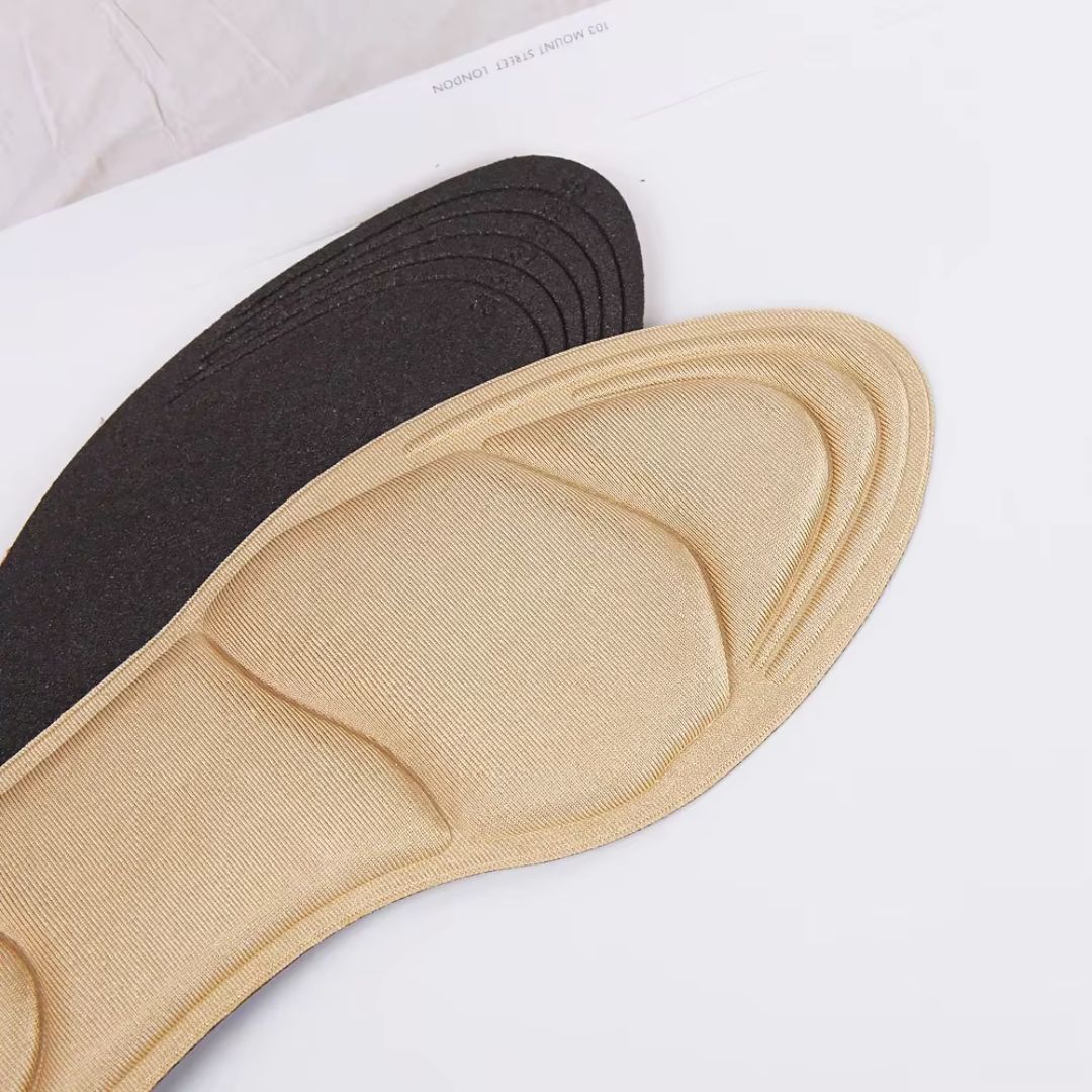 Slim nude and black insoles that cushion the ball of the foot inside high heels