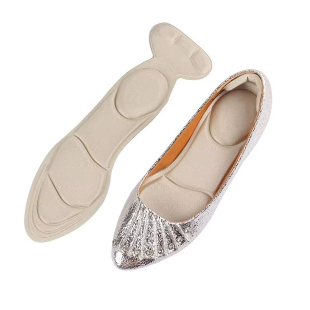 Slim nude and black insoles that cushion the ball of the foot inside high heels