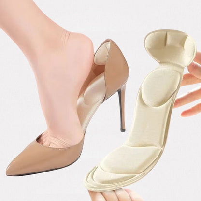 Slim nude and black insoles that cushion the ball of the foot inside high heels