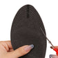 Slim nude and black insoles that cushion the ball of the foot inside high heels