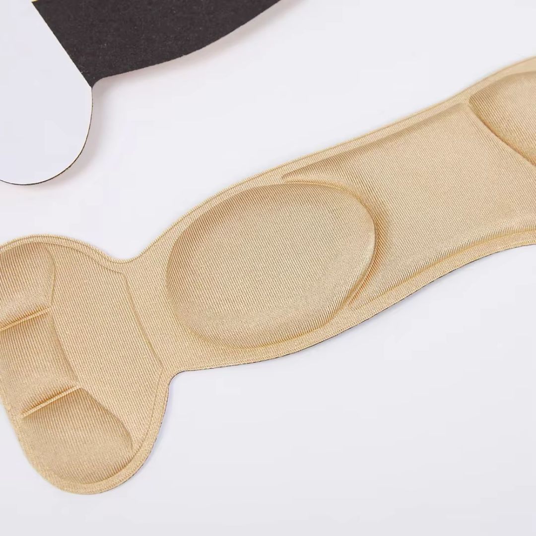 Slim nude and black insoles that cushion the ball of the foot inside high heels