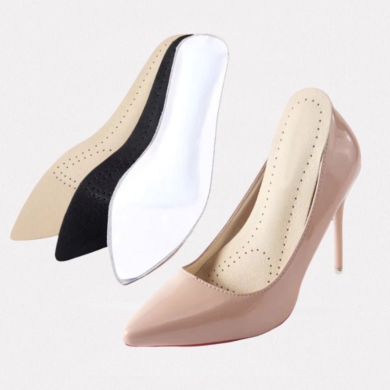 Nude leather half insoles placed in high heels under the ball of the foot