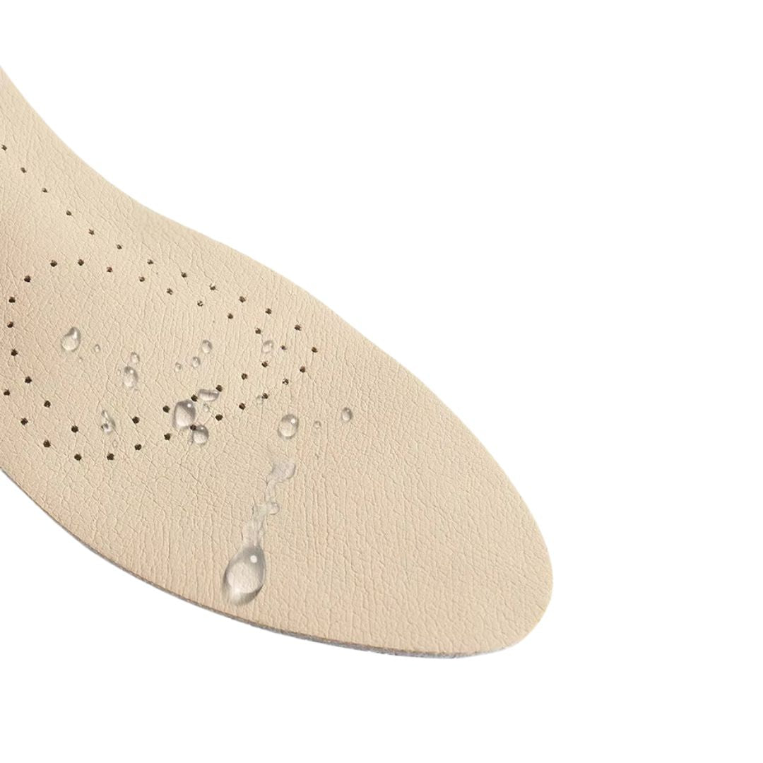 Nude leather half insoles placed in high heels under the ball of the foot