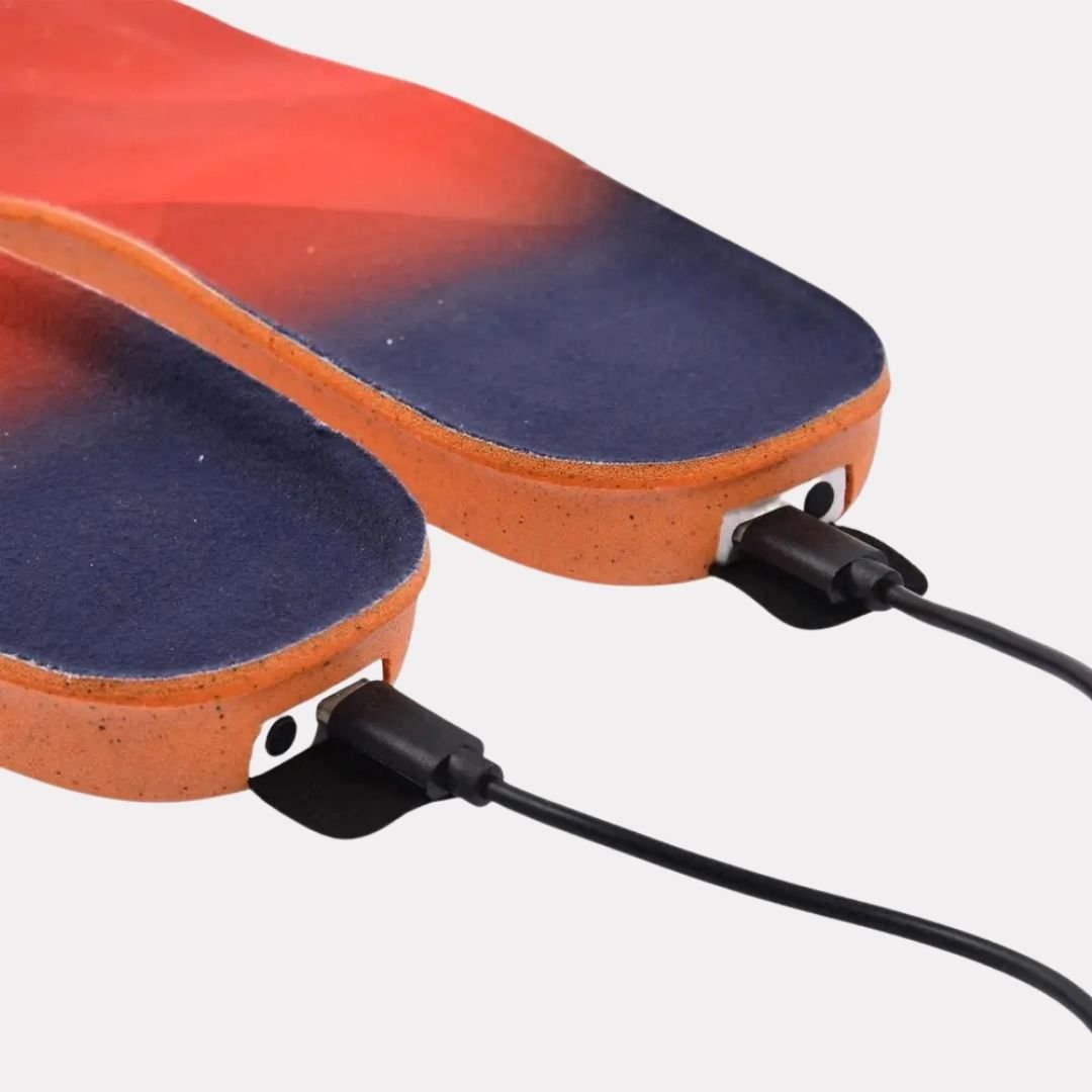 Heated insoles that warm the sole of the foot, sized to sit inside hiking and hunting boots