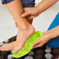 Magnetic acupressure insoles with raised massage points, in green and gray pairs